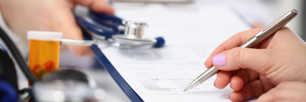 Close-up of woman put signature on paper with prescriptions for diagnostics. Clipboard with doctor advice for treatment. Healthcare, hospital, care concept