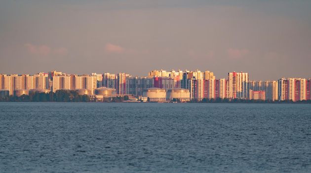 The residential complex on the embankment of the Neva River on Vasilievsky island in sunset. High quality photo