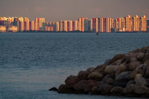 The residential complex on the embankment of the Neva River on Vasilievsky island in sunset. High quality photo