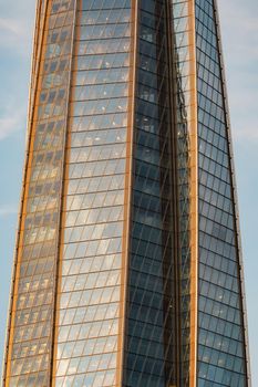 Russia, St. Petersburg, 10 June 2022: The skyscraper Lakhta center of the gas company Gazprom at sunset, glass and iron facade. High quality photo