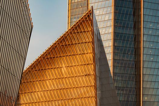 Russia, St. Petersburg, 10 June 2022: The skyscraper Lakhta center of the gas company Gazprom at sunset, glass and iron facade. High quality photo