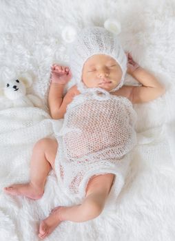 Newborn baby sleeps in a hat. Selective focus. people.