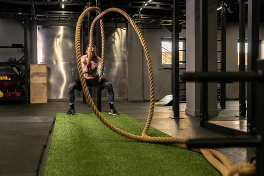 Rope man grass warehouse green fitness training gym exercising exercise, for athlete one from male from healthy moving, sport muscle. Standing ground holding, lifestyles