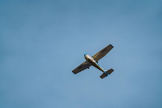 light-engine aircraft against a backdrop of blue skies at sunset. High quality photo
