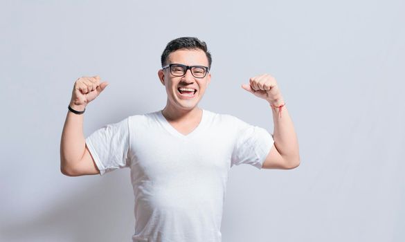 Person with Happy face raising arms in victory gesture isolated, winner person celebrating victory isolated, excited man raising arms celebrating victory