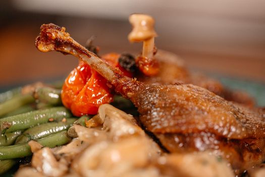 Appetizing Duck Meal Fried Tomato Decorated Close Up Details of Cooking.