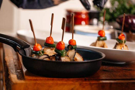 Fried Eggplant with Peppers, tomatoes and Appetizing Fried Beef Meatballs. Food Art.