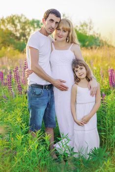 Pregnant woman family photo shoot. Selective focus.