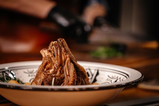 Lamb Ribs Meat Dish Served with Vegetables and Arugula.