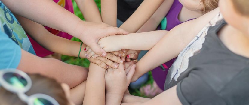 Children's hands together, street games. Selective focus. Kids.