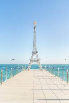 Large model of the Eiffel Tower on the beach