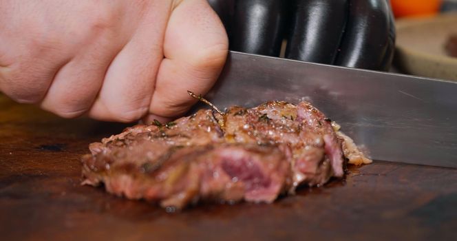 Chef Cutting a Medium Cooked Beef Looks Very Tasty Close Up About Food Art.