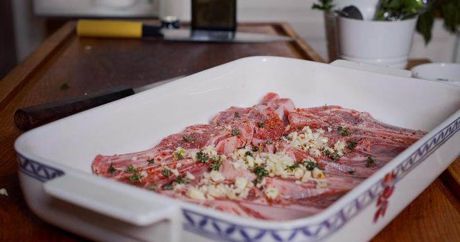 Lamb Meat Seasoned With Spices, Garlic, Herbs before Cooking. Juicy Raw Lamb