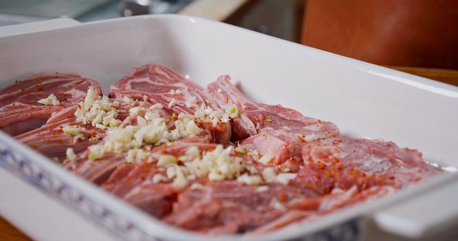 Lamb Meat Seasoned With Pepper, Garlic, Salt before Cooking. Juicy Raw Lamb.
