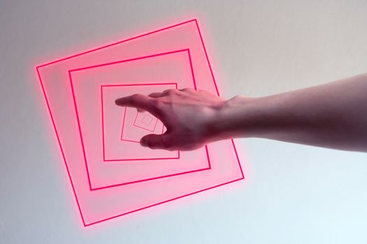 Hand entering in a neon light as a gate for new dimensions. Concept of new contemporary technology like metaverse, augmented reality and artificial intelligence.