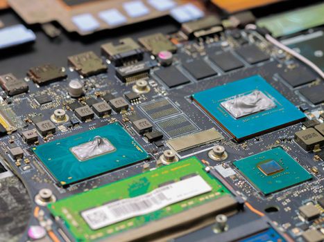 Thermal paste on the processor and graphics processor. Old thermal grease on the processor close-up.