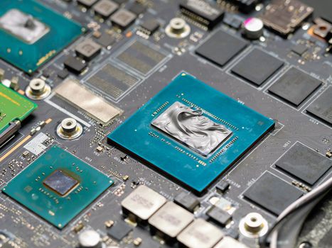 Applying thermal paste to a laptop graphics processor, cooling computer components. Repairing, upgrade and technology.