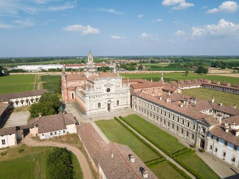 Aerial view of the Certosa di Pavia at sunny day, built in the late fourteenth century, courts and the cloister of the monastery and shrine in the province of Pavia, Lombardia, Italy