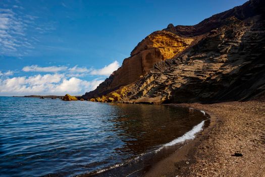 View of the Linosa volcano called Monte Nero in the beach of Cala Pozzolana di Ponente. Linosa is one of the Pelagie Islands in the Sicily Channel of the Mediterranean Sea