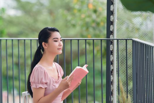 Young Woman Reading Book Concept