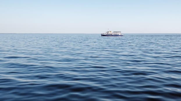 Blue lagoon, blue sky, and blue tourist boat. A relaxing trip to the sea on a sunny summer day