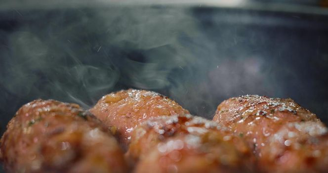 Meatballs Frying on Hot Pan