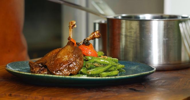 Appetizing Duck Meal Fried Tomato Decorated Close Up Details of Cooking.