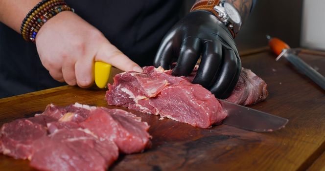 Cutting Pieces of Fresh Raw Beef Meat. Juicy Fresh Meat.