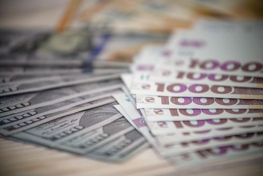 Dollar banknotes of the USA. Amerikan dollars. Money of USA and Ukrainian hryvnia. 1000 Ukrainian hryvnia.