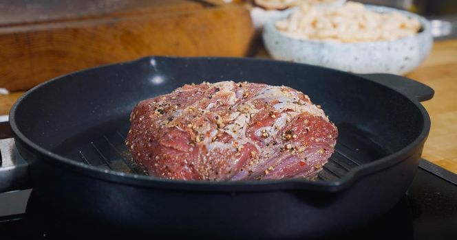 Delicious Juicy Meat Steak Cooking on Grill. Hot Pan. Close Up.