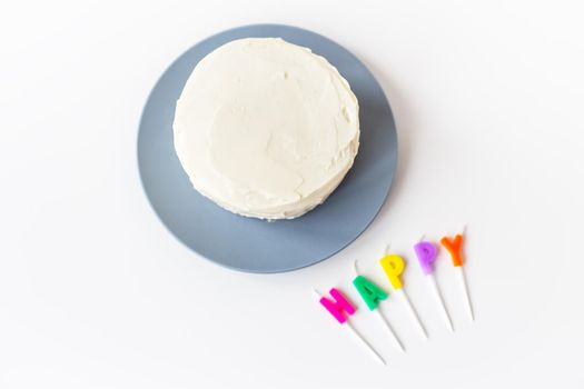 Preparing for a birthday cake, the inscription happiness on a creamy biscuit. Surprise holiday and birthday concept