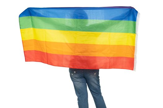 Asian lady holding rainbow color flag, symbol of LGBT pride month celebrate annual in June social of gay, lesbian, bisexual, transgender, human rights.
