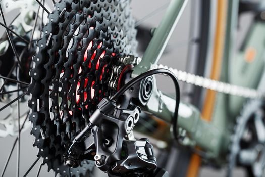 Rear bicycle cassette speeds with a wide range and chain close-up, accessories for repair and tuning of the bike