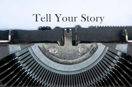 Tell your story text on an old typewriter.