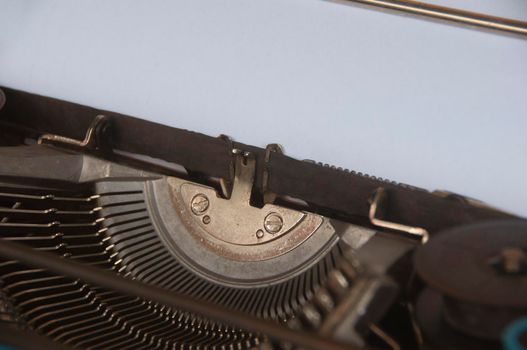 Selective view of an old typewriter in vintage color. Copy space.