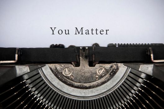 You matter text typed on an old vintage typewriter. Motivational and inspirational concept