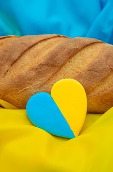 Bread on the Ukrainian flag. Selective focus. love.
