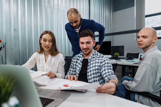 Young business team working on a project in modern office.