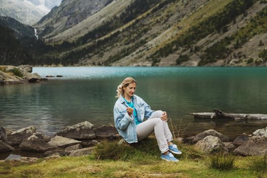 Girl near a french lake Gaube at the high pyrenees