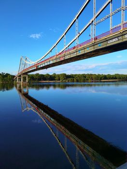 Kyiv, Ukraine - May 24, 2022: Landscape of the pedestrian bridge in Kiev. Summer time.