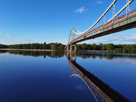 Kyiv, Ukraine - May 24, 2022: Landscape of the pedestrian bridge in Kiev. Summer time.