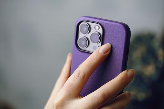 Female's hands with iPhone 13 pro. Photos for advertising apps and gadgets with copy space. Smartphone with triple-lens camera Ultra Wide, Wide and Telephoto. Bishkek, Kyrgyzstan - January 24, 2022