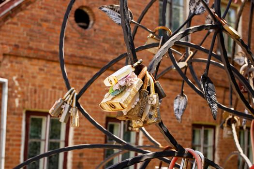 Lovers' locks hang on the bridge close up