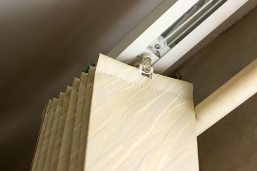 Blinds fixing system to the cornice close up