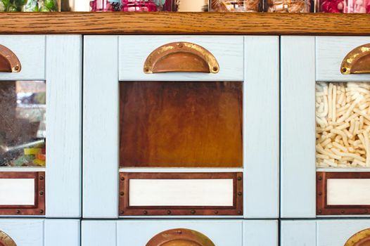 Empty box drawer with glass front in a display cabinet in a sweet shop - product template with copy space