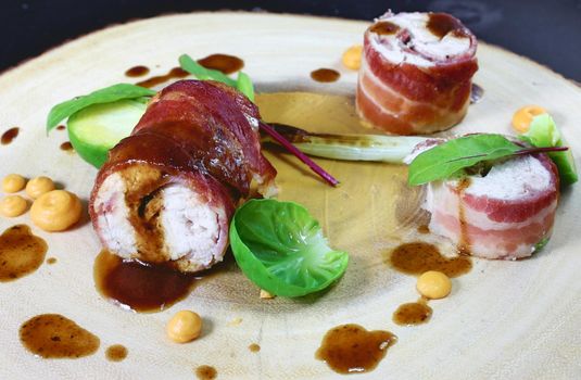 Stuffed chicken roulade wrapped in bacon served with sweet potatoe puree, chargrilled baby leek and buttered brussel sprouts, drizzled with sherry jus