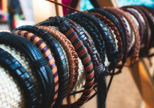 Assorted handmade genuine leather bracelets on display for sale