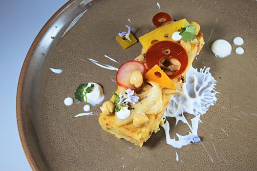 Moroccan style polenta served with yogurt gel and pickled vegetables