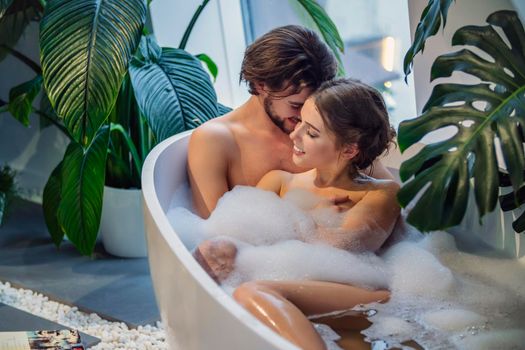 young couple bathing in the bathroom