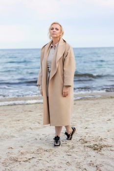 Aged woman on the background of the sea